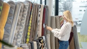 lady looking at area rugs